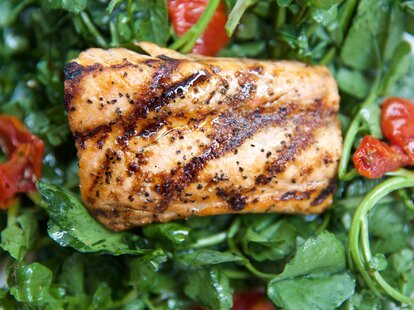 grilled Salmon on a bed of spinach salad