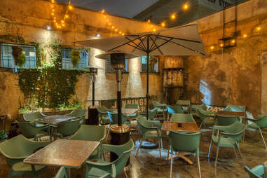 Wine bar with green chairs at 13 Celsius