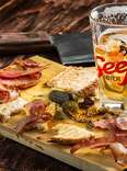 pints of beer with cheese and charcuterie board at Paddy Long's