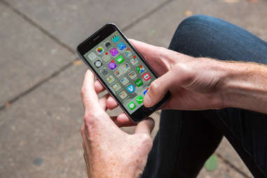 Man checking his apps on the iPhone 6s smartphone