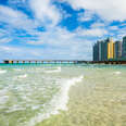 North Beach Miami ocean with pier, coast, condos, and other buildings in Florida
