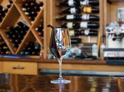 Wine glass with liquid in motion