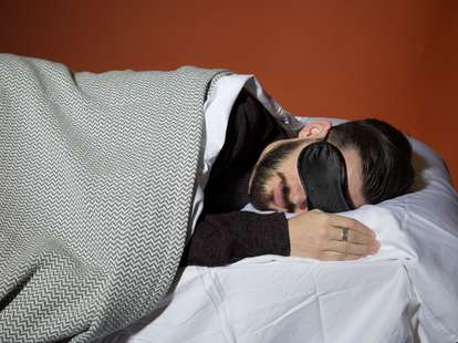 Man sleeping with eye mask