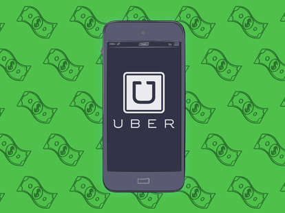 Uber app in a phone with money