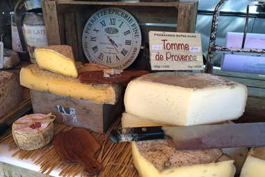 French cheeses set outside with butcher's knife