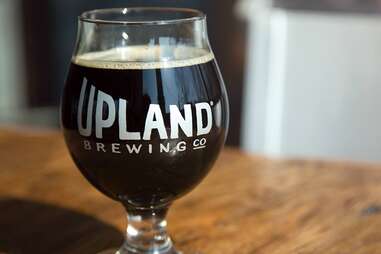 dark beer in a glass from upland brewing co