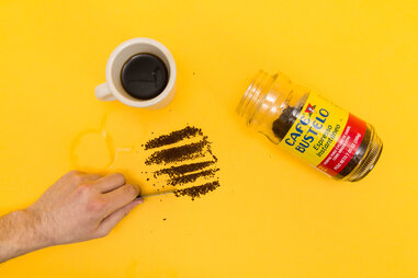 Hand cutting lines of coffee, Cafe Bustelo instant coffee