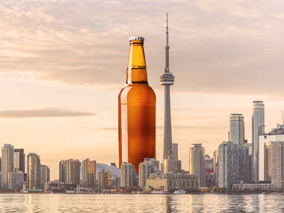 beer bottle imposed on skyline