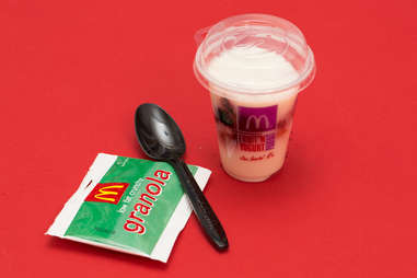 McDonald's yogurt parfait with granola and plastic spoon