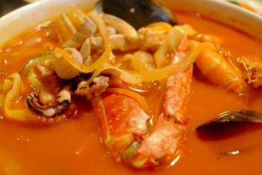 spicy broth with seafood, mussels, crab