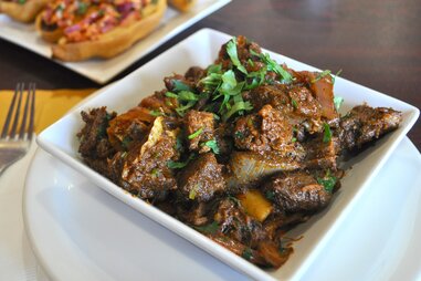 Pradesh-style goat pepper fry wirh meat and gravy at Paradise Biryani