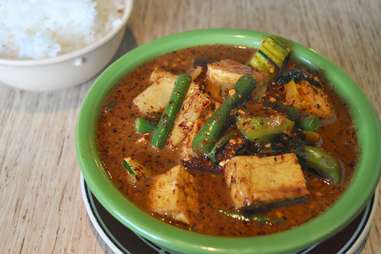 Thai hot green curry with tofu, eggplant, green beans at US Thai