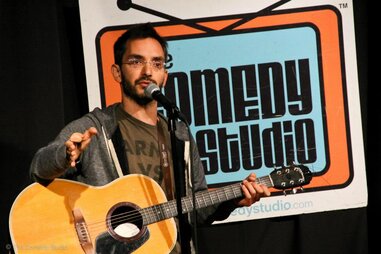 Comic performing at the Comedy Studio in Boston