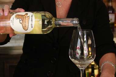 Bartender pouring a glass of white wine at Morels bar at The Palazzo in Las Vegas, Nevada