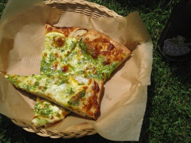 Thin slices of pizza sitting in basket
