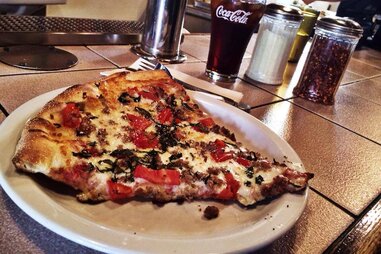 Slice of pepperoni and cheese pizza from Za