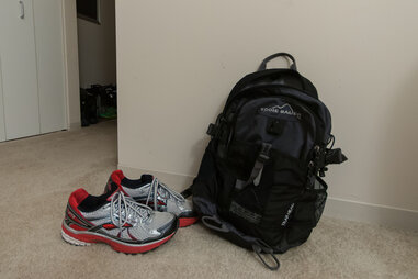 gym backpack and sneakers near a doorway