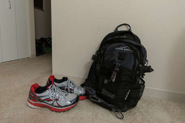 gym backpack and sneakers near a doorway