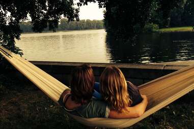 Couple overlooking Amsterdam lake from a hammock