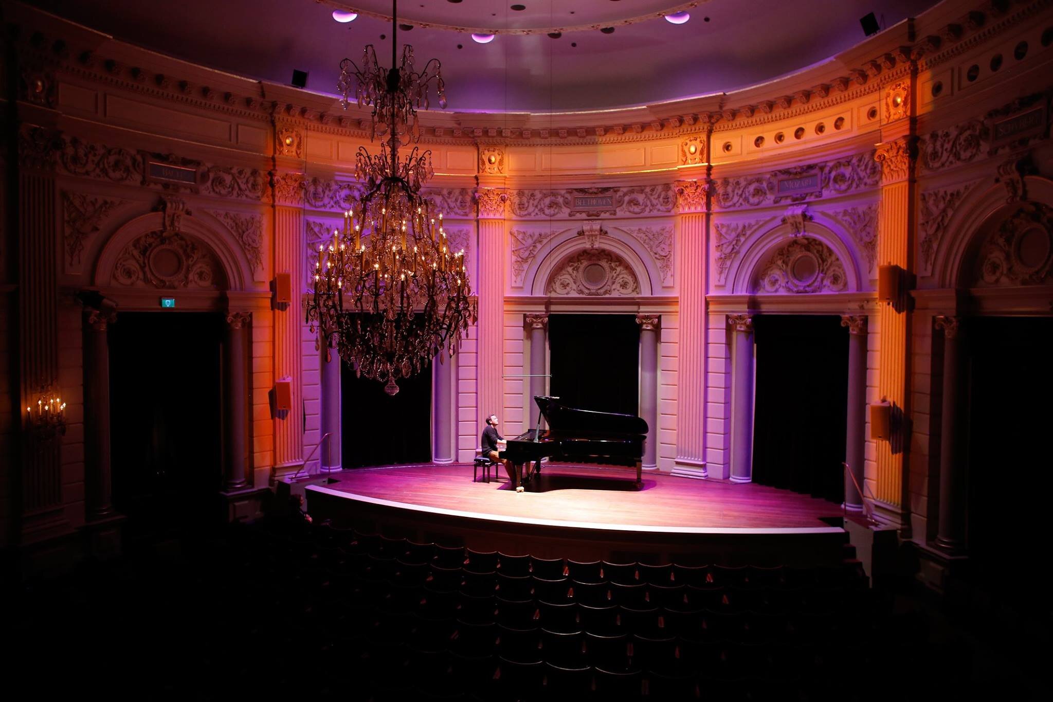 Man playing piano at classical Amsterdam concert hall