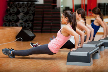 women in group fitness class, triceps