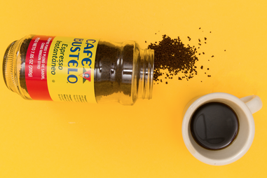 Spilled cafe bustelo and cup of coffee