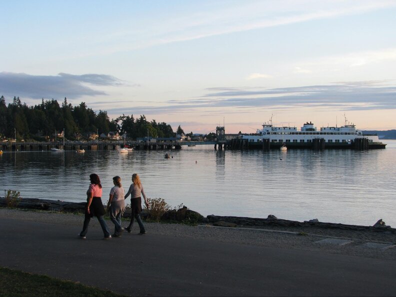 walking along the water at Lincoln Park in Seattle