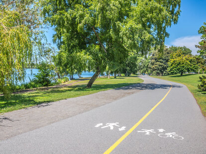 running and biking path in a park