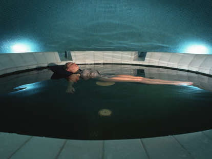 Woman floating in sensory deprivation pool