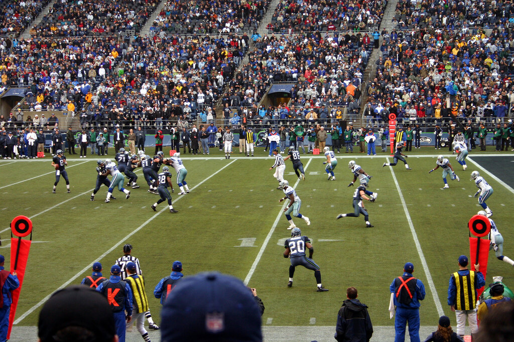 Dallas cowboys running on field during game
