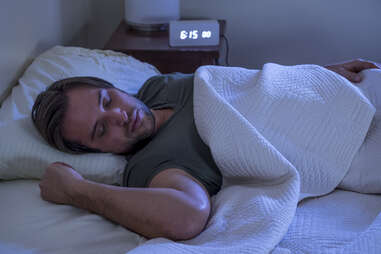Man sleeping peacefully in comfortable bed