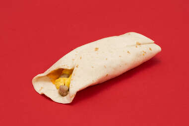 McDonald’s sausage burrito on red background