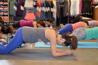 Woman in plank position at Atlanta Lululemon store