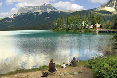 Family summer camp on lake with cabin
