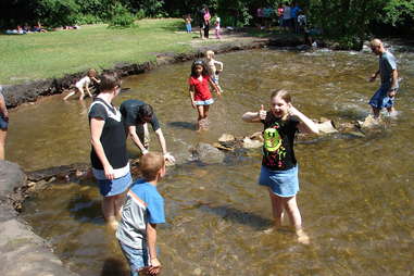 Kids playing in Minnesota pond after long winter