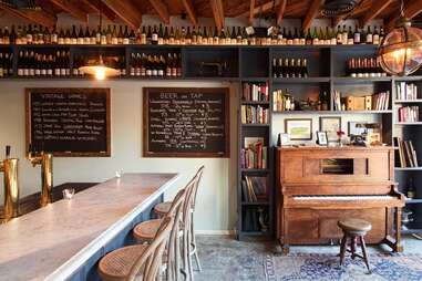 interior of Augustine wine bar, piano