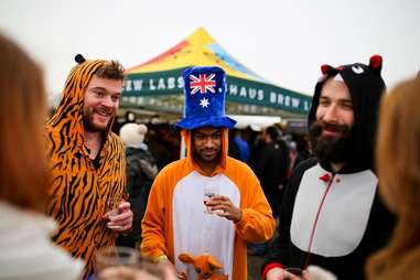 Grown adults drinking and wearing costumes