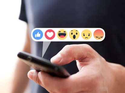 Facebook reactions projecting from an iPhone