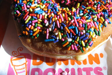 donut with chocolate frosting and rainbow sprinkles from dunkin donuts