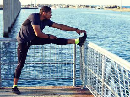 Jogger stretching before workout