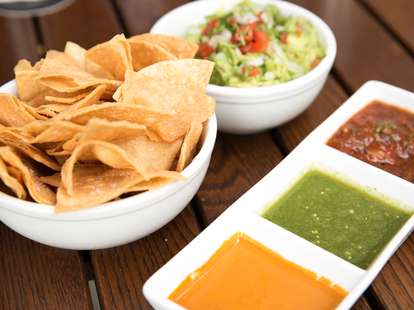 Salsa and guacamole dip with tortilla chips