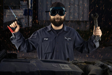 Car mechanic with tools