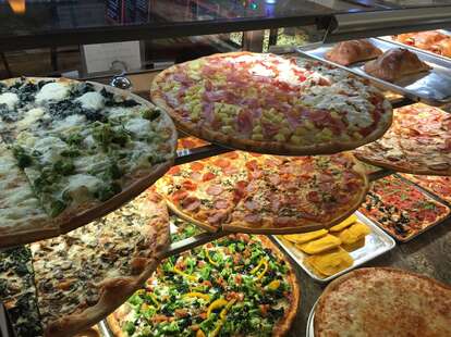 pizzas on display at previti pizza in manhattan new york city nyc