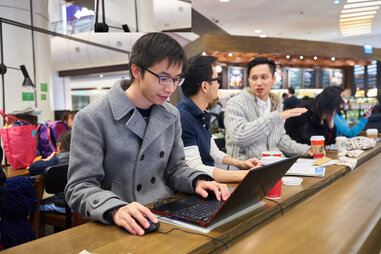 Man working on his laptop at Starbucks