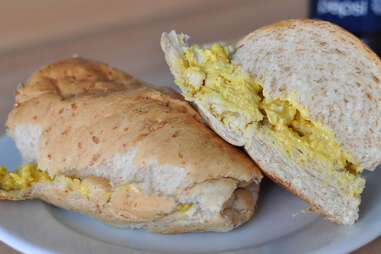 coronation chicken sandwich on white plate
