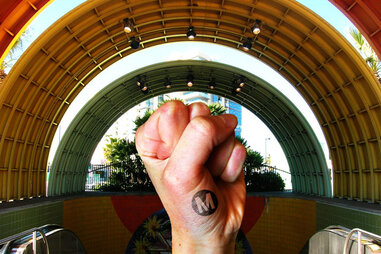 metro los angeles station, with a fist raised