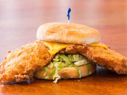 Pork tenderloin sandwich with cheese and lettuce