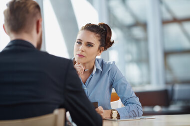 woman interviewing man