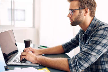 man working on his laptop