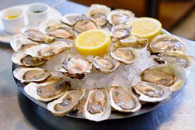 raw oysters with lemon at John Dory Oyster Bar